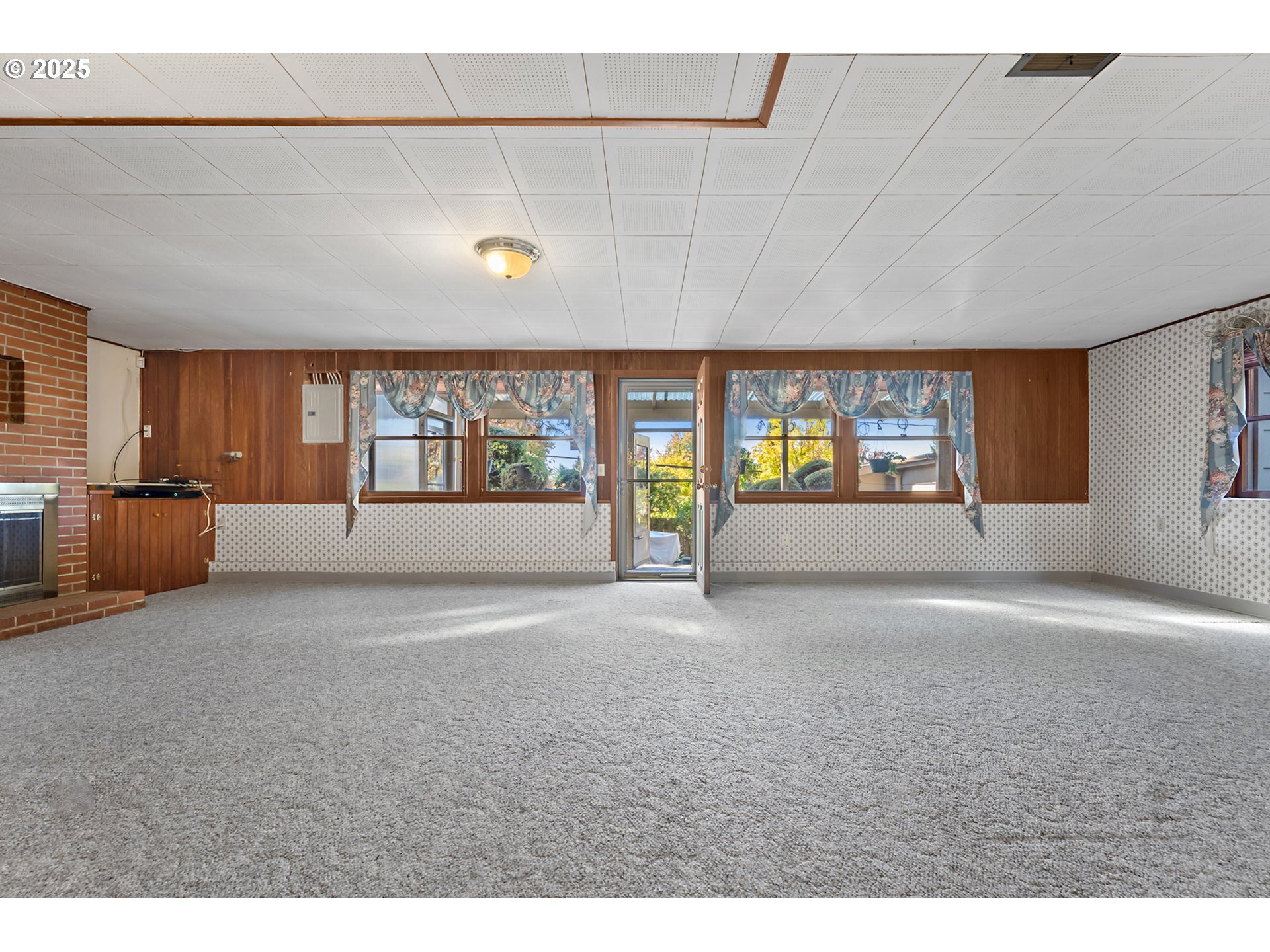 4430 Southeast Flavel Street Portland, OR 97206 - Photo 26 of 43 a living room with furniture and a large window
