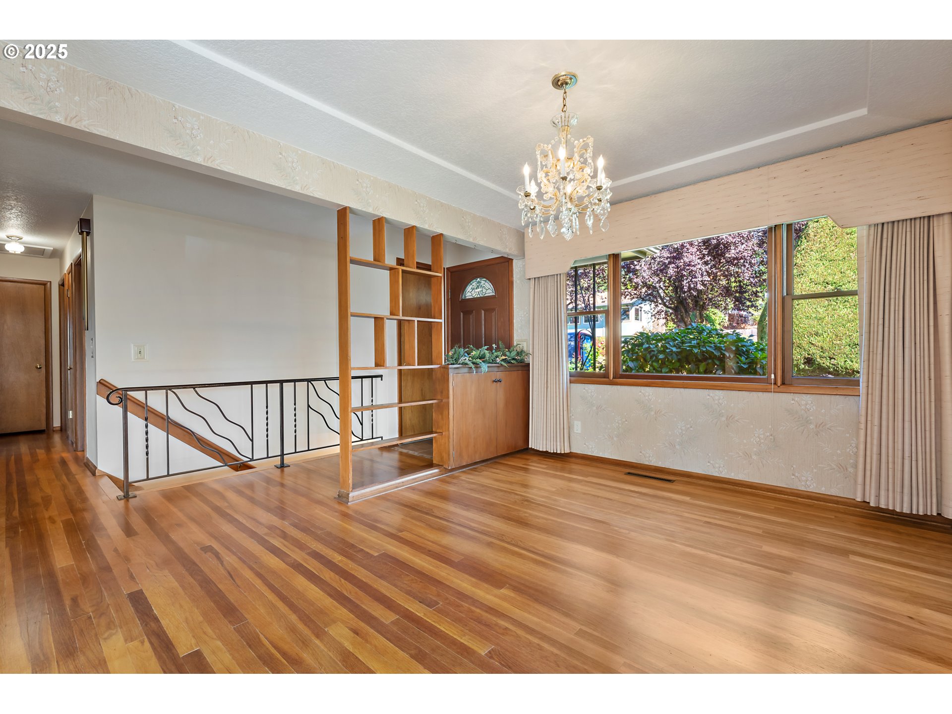 4430 Southeast Flavel Street Portland, OR 97206 - Photo 5 of 43 a view of a room wooden floor staircase and windows