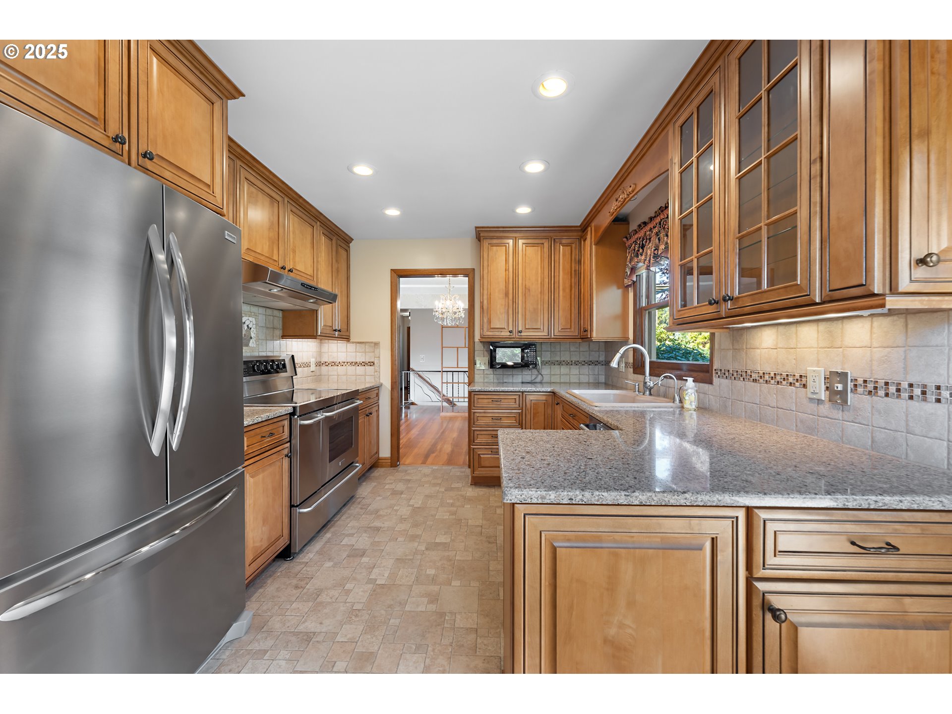 4430 Southeast Flavel Street Portland, OR 97206 - Photo 8 of 43 a kitchen with stainless steel appliances granite countertop a refrigerator a stove and a sink