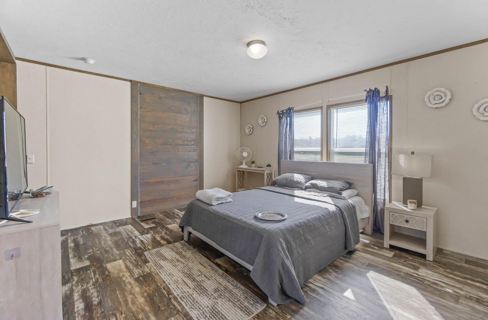 3139 Creek Road Bonifay, FL 32425 - Photo 11 of 41 a bedroom with a bed and a flat screen tv