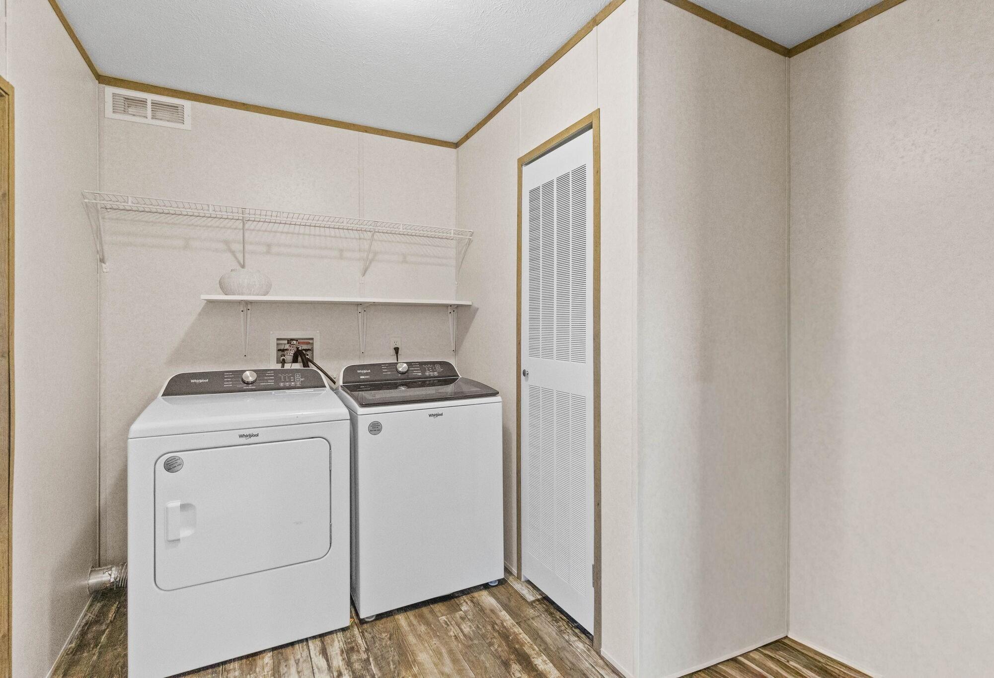 3139 Creek Road Bonifay, FL 32425 - Photo 8 of 41 a view of storage and utility room with washer and dryer