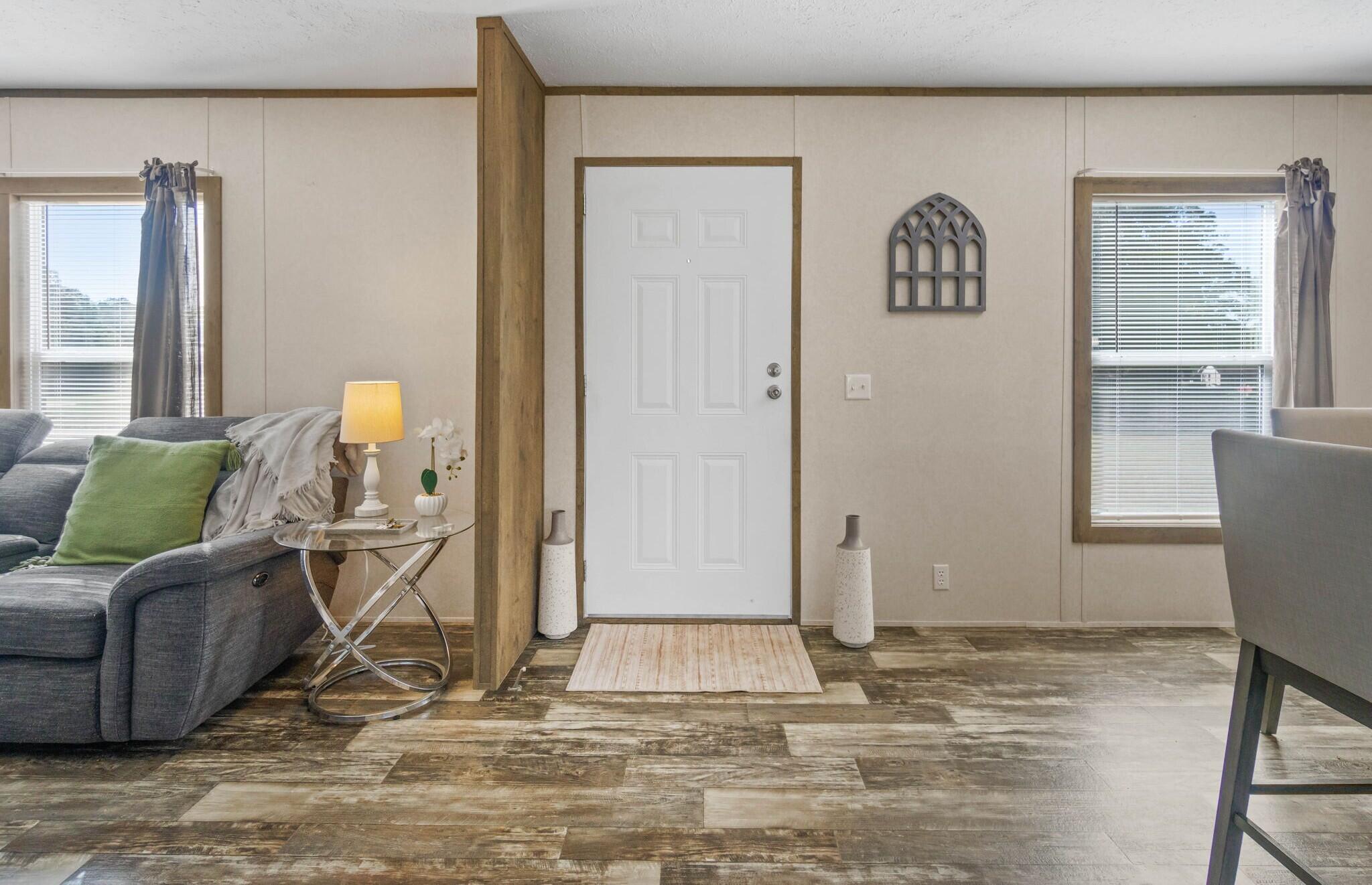 3139 Creek Road Bonifay, FL 32425 - Photo 9 of 41 a living room with a couch and a table