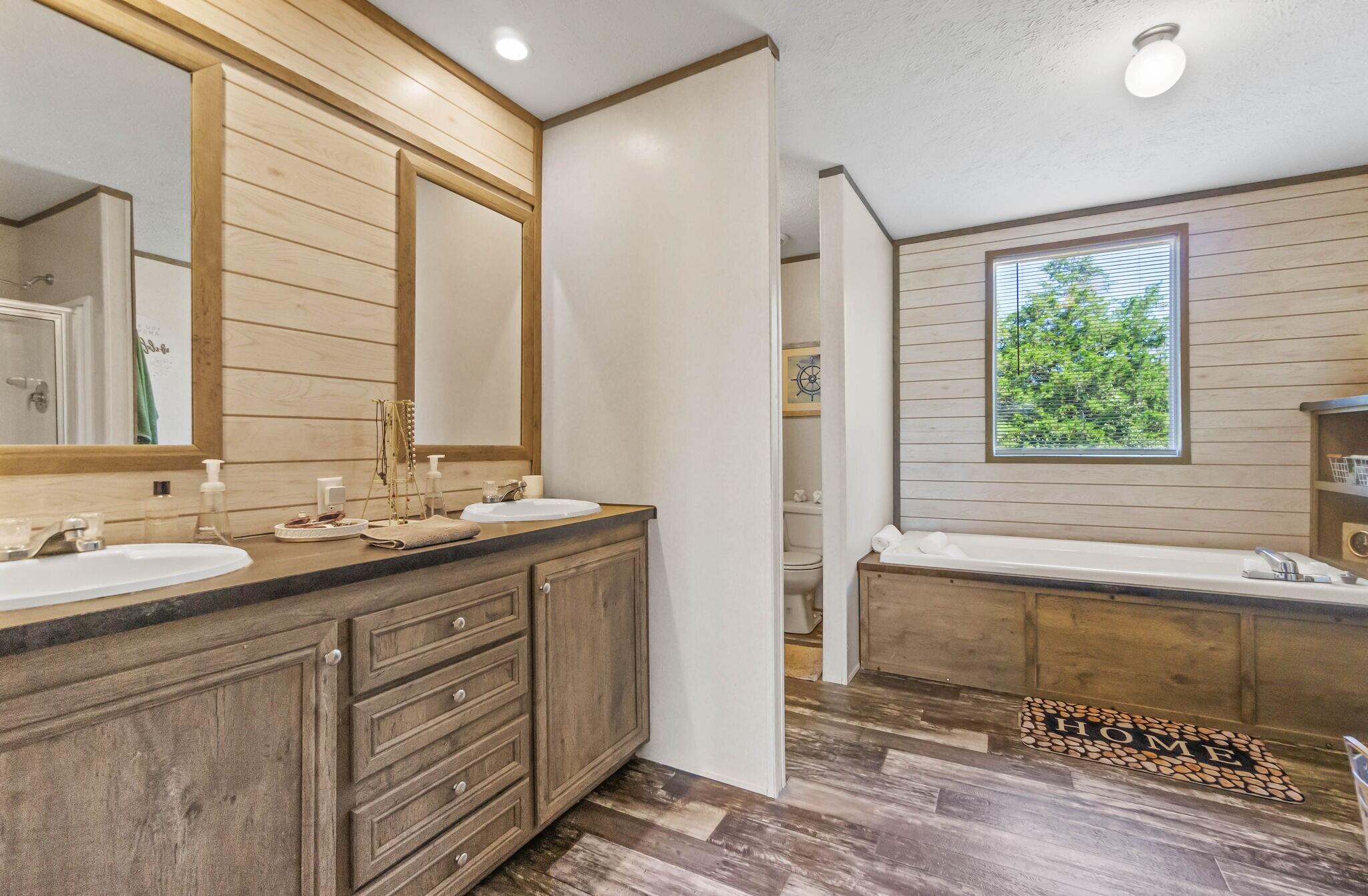 3139 Creek Road Bonifay, FL 32425 - Photo 10 of 41 a bathroom with a double vanity sink and a mirror