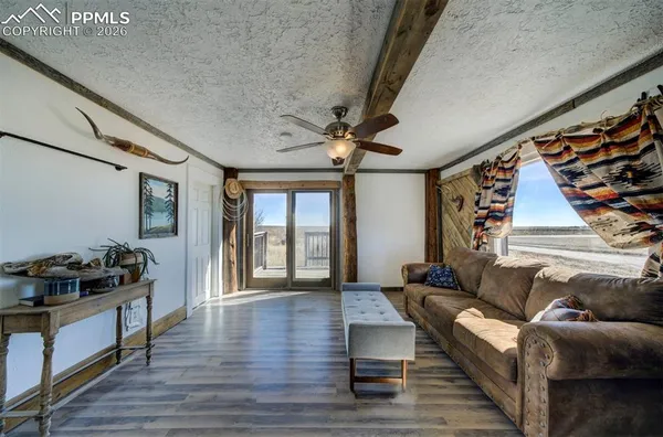 a view of empty room with window and air conditioner