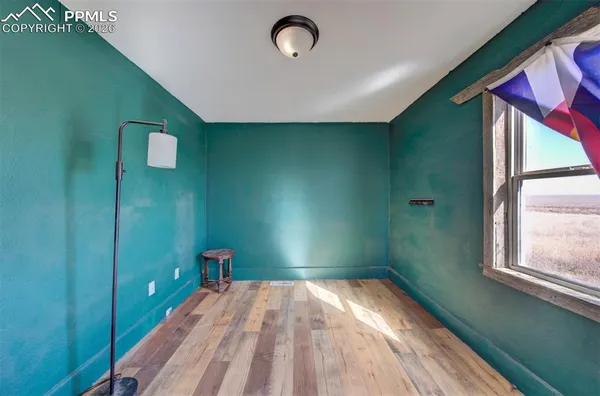 a bedroom with a bed and a bookshelf