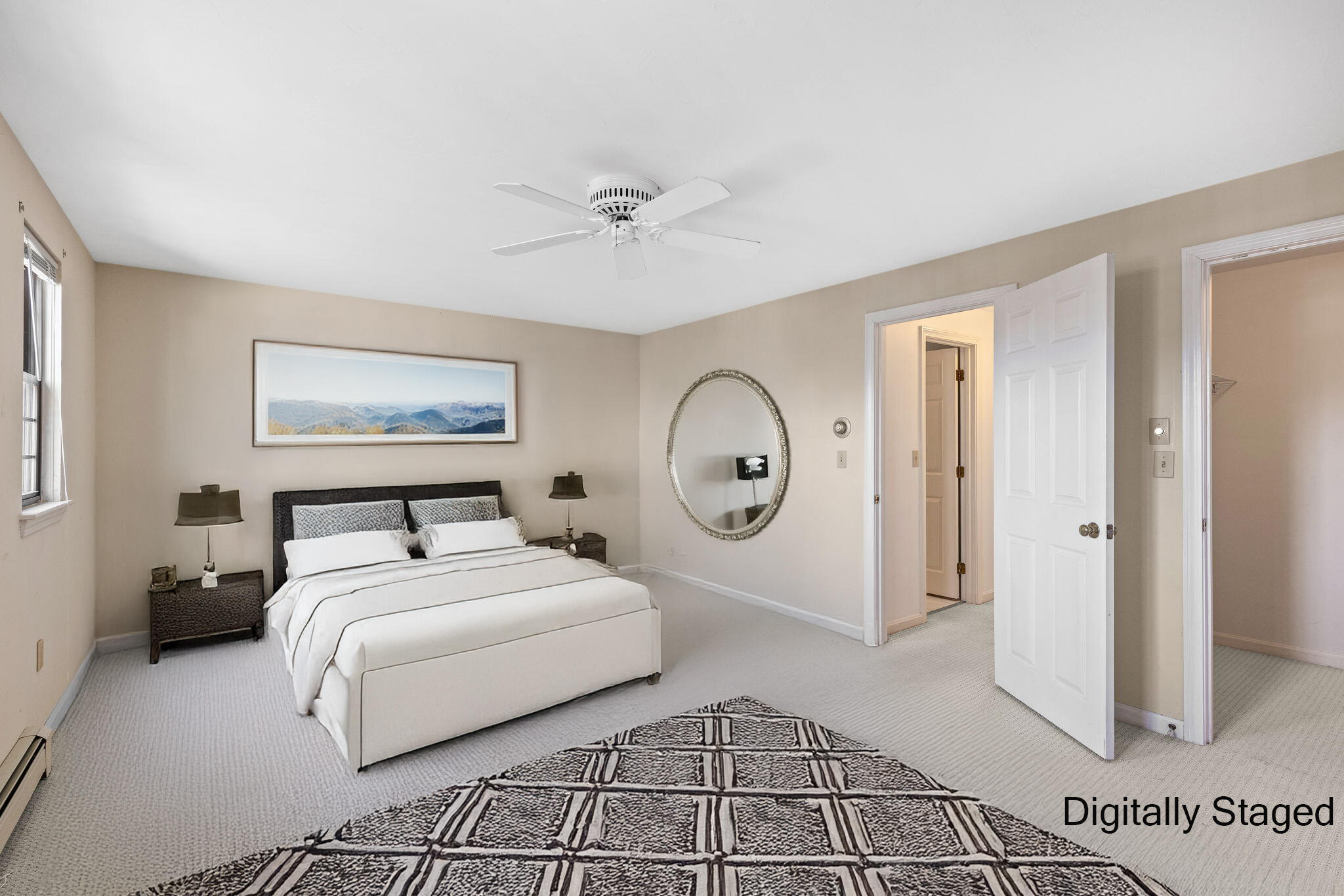 33 West Road, Unit 1B Orleans, MA 02653 - Photo 12 of 28 a spacious bedroom with a bed and a chandelier