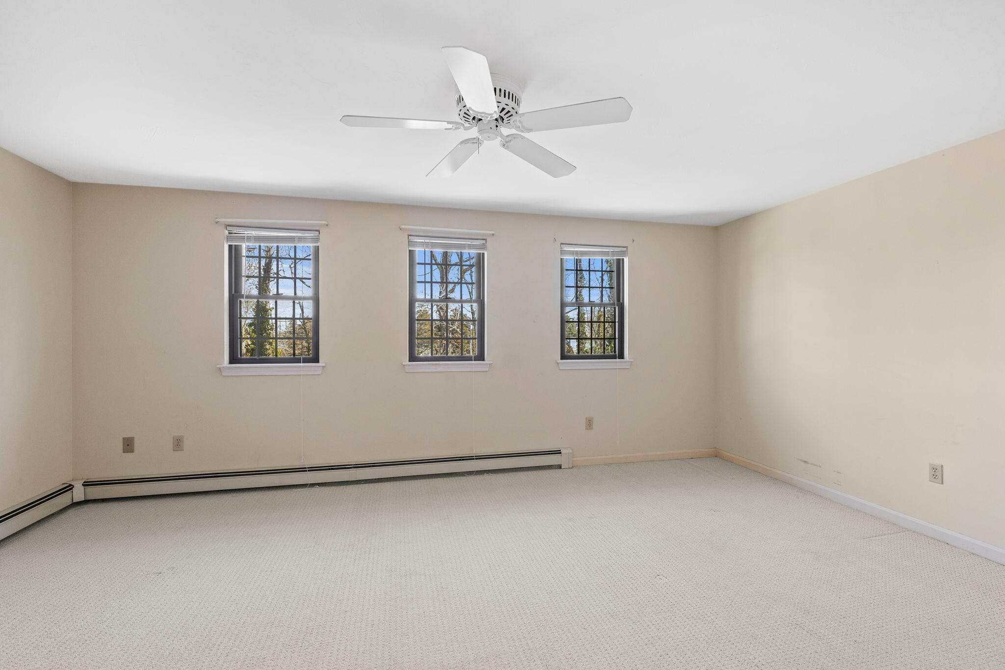 33 West Road, Unit 1B Orleans, MA 02653 - Photo 15 of 28 an empty room with windows and fan