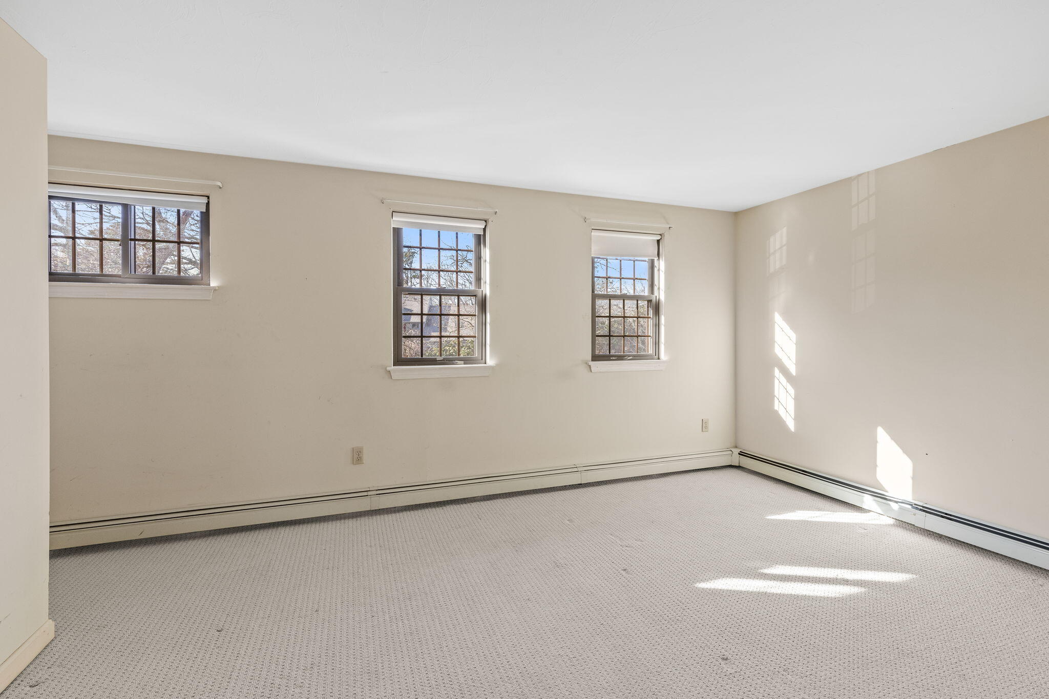 33 West Road, Unit 1B Orleans, MA 02653 - Photo 17 of 28 an empty room with windows