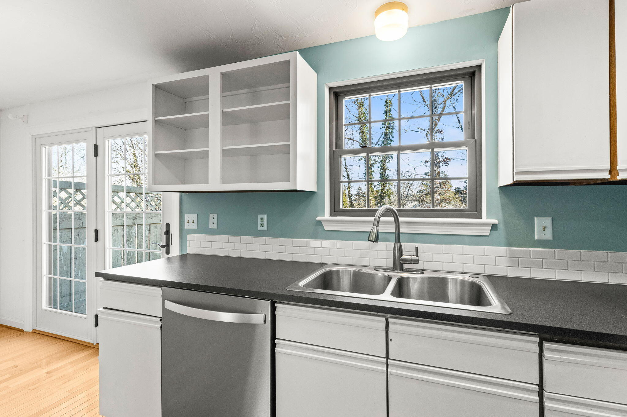 33 West Road, Unit 1B Orleans, MA 02653 - Photo 9 of 28 a kitchen with stainless steel appliances a sink a stove and a window