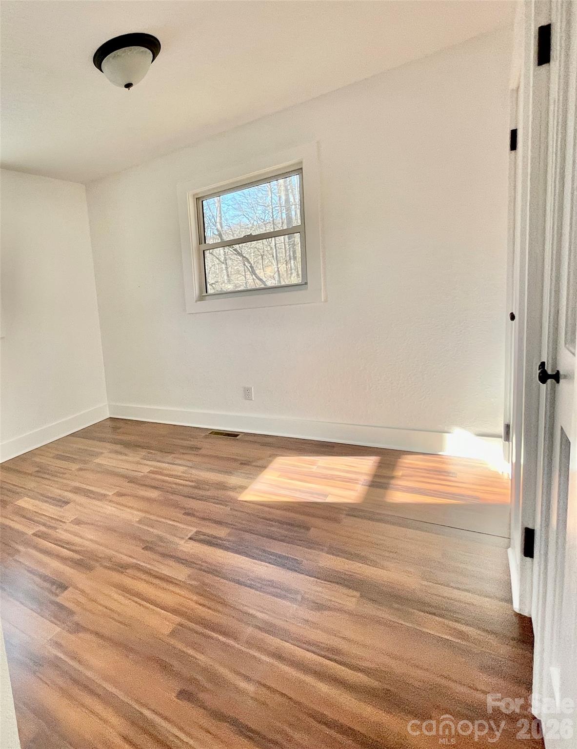 2019 Dale Road Spruce Pine, NC 28777 - Photo 12 of 18 a view of room and wooden floor