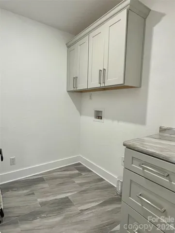 a view of cabinets and wooden floor