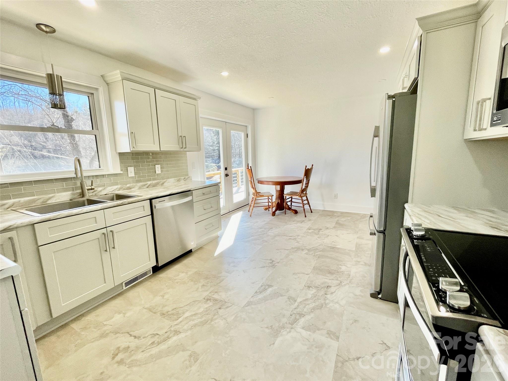 2019 Dale Road Spruce Pine, NC 28777 - Photo 9 of 18 a kitchen with a sink appliances and cabinets