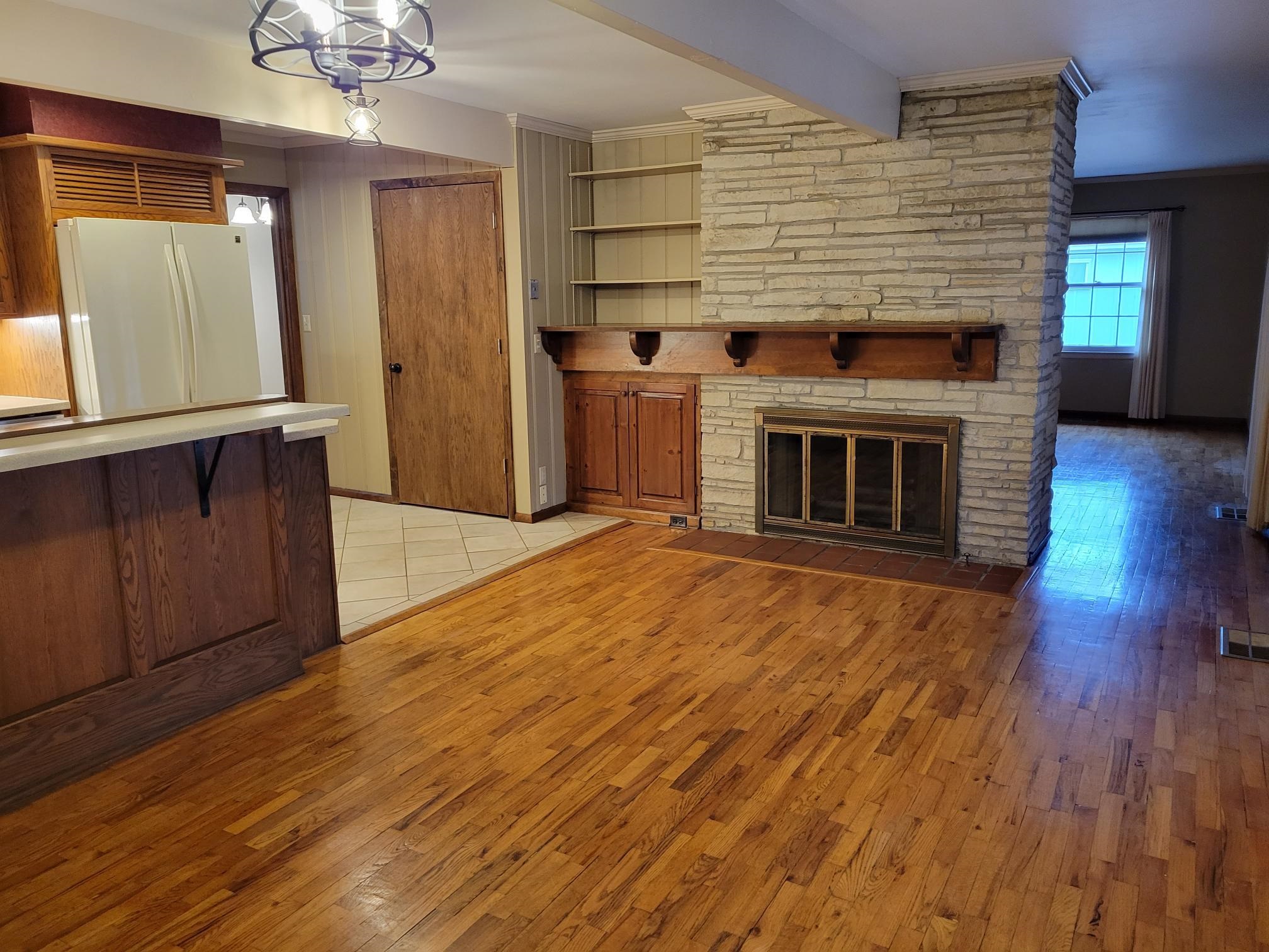 135 Redbud Drive Winfield, KS 67156 - Photo 5 of 29 Beautiful hardwood floors and beamed ceilings make this a very cozy room