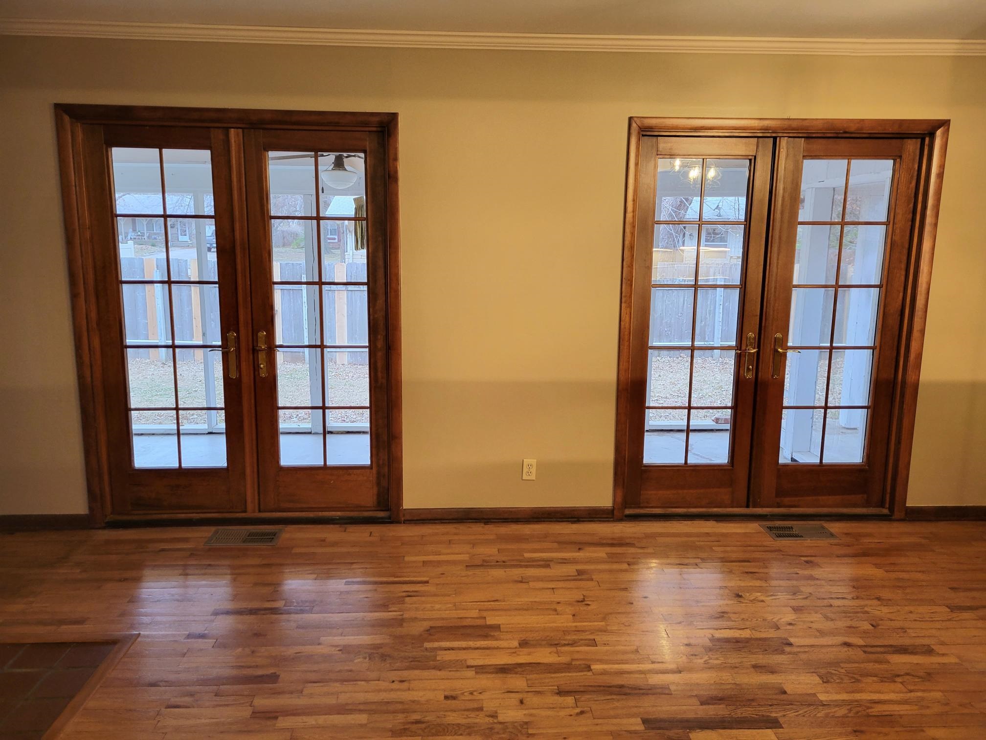 135 Redbud Drive Winfield, KS 67156 - Photo 7 of 29 There are two sets of patio doors that exit to the large screened in porch