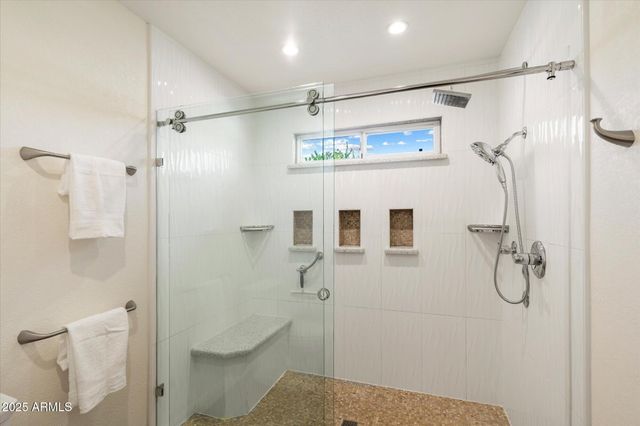 a bathroom with a shower and toilet