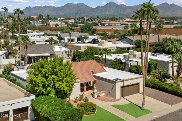 an aerial view of residential houses and outdoor space