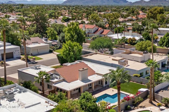 an aerial view of residential houses with outdoor space and street view