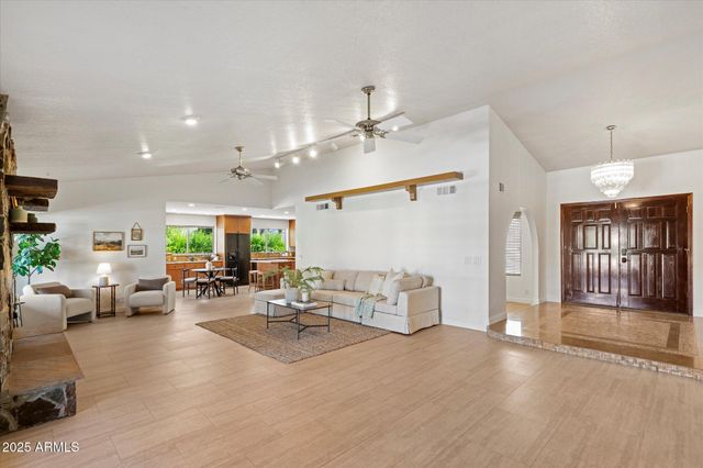 a living room with furniture window and wooden floor
