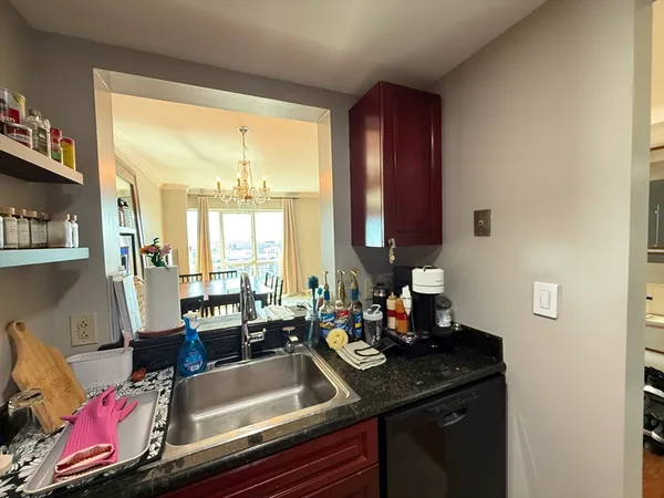 a kitchen with a sink and a window