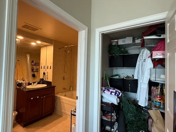 a kitchen with a refrigerator and a stove