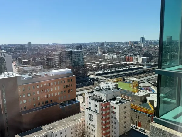 a view of a city with tall buildings