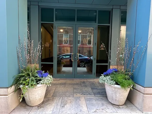 a view of a porch with dining table and chairs potted plants