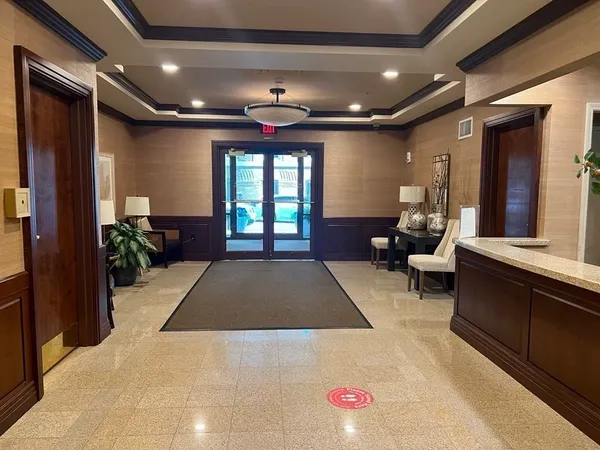 a lobby with furniture and window