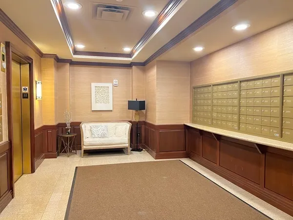 a spacious bedroom with a large bed and furniture