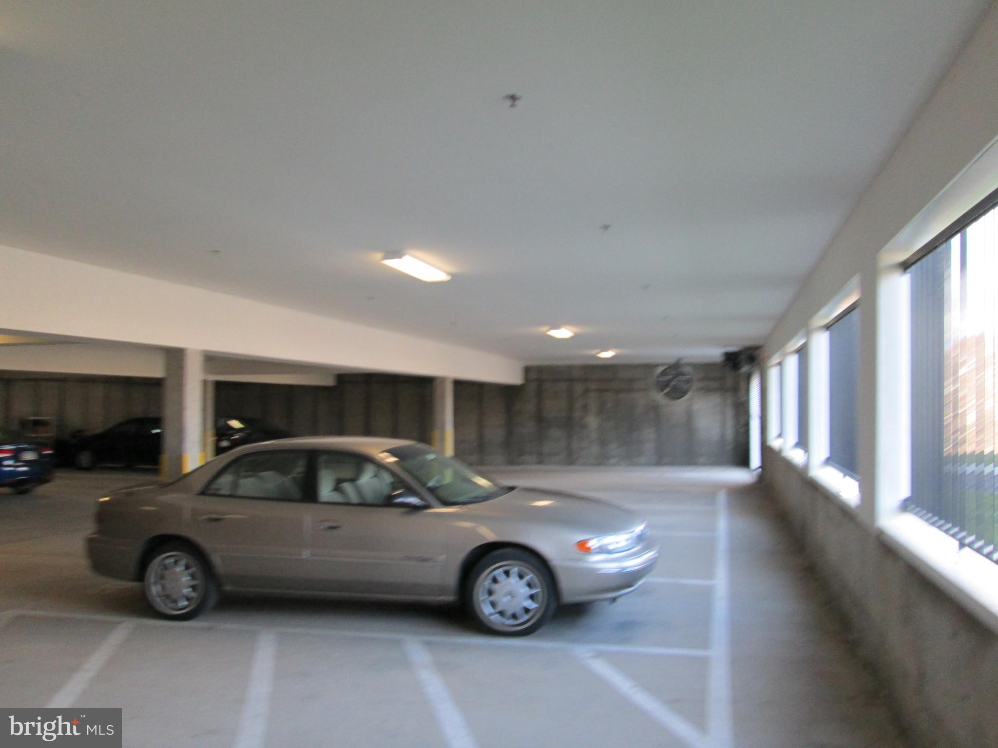 79 Legacy Boulevard, Unit 106 Sinking Spring, PA 19608 - Photo 11 of 11 a view of parking garage with cars parked