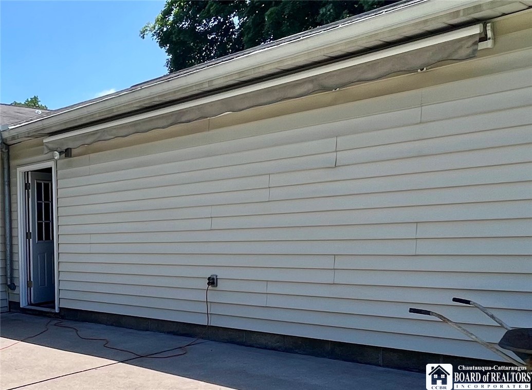 3194 Cranberry Road Allegany, NY 14760 - Photo 5 of 50 retractable awning on back patio