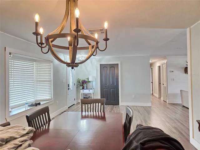 a view of a livingroom with furniture and windows