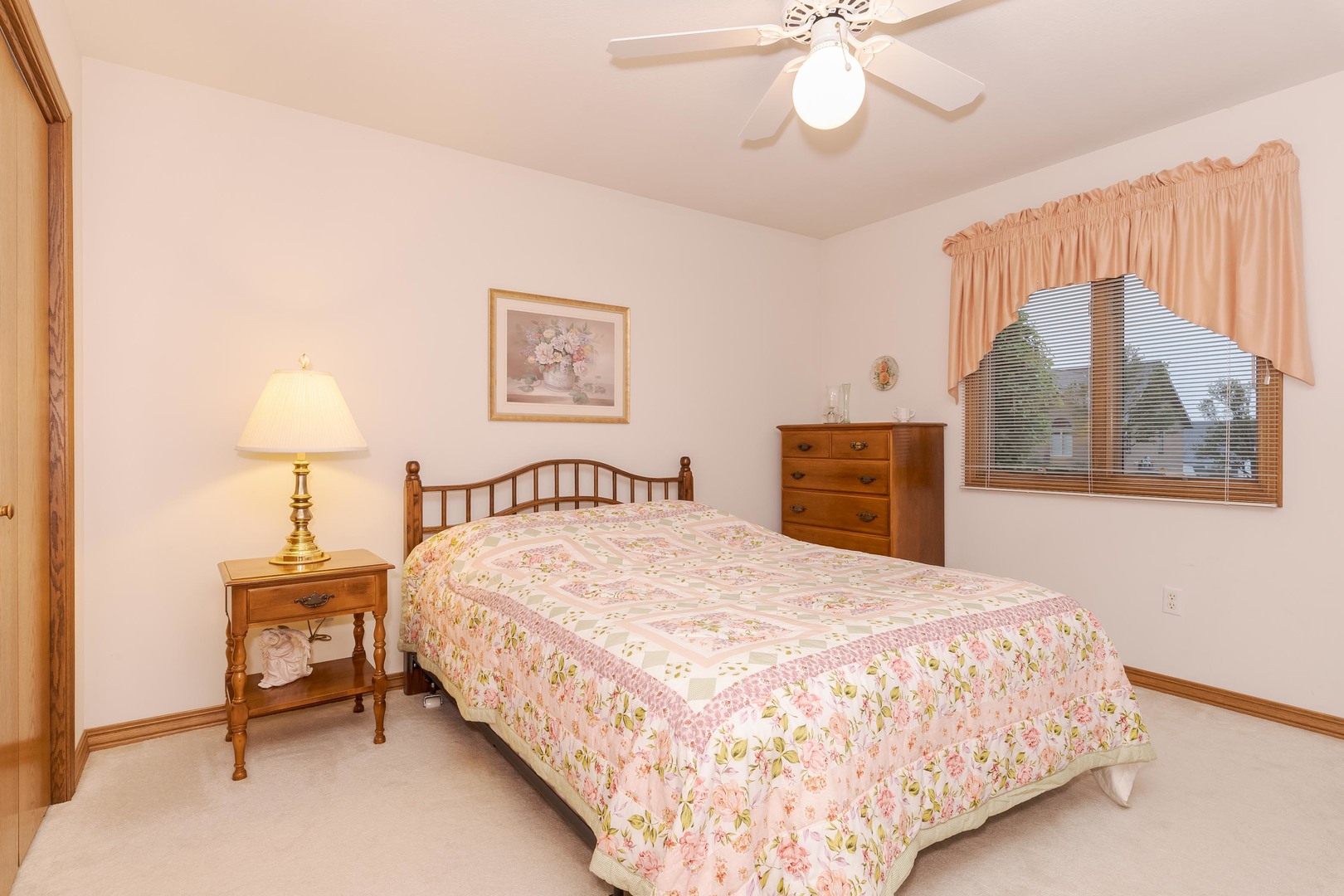 103 East 9th Street Gridley, IL 61744 - Photo 20 of 45 a bedroom with a bed and a chandelier