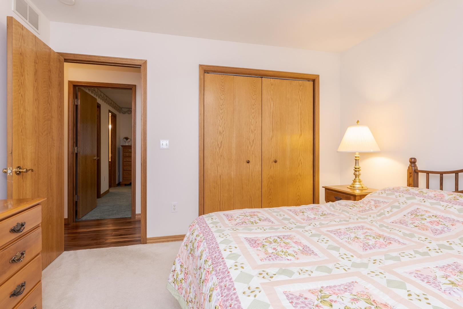 103 East 9th Street Gridley, IL 61744 - Photo 21 of 45 a bedroom with a bed and a lamp