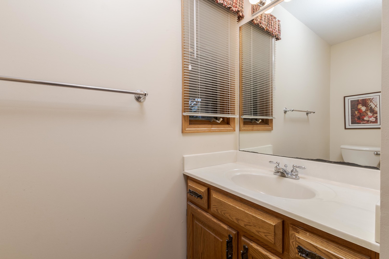 103 East 9th Street Gridley, IL 61744 - Photo 25 of 45 a bathroom with a sink and a mirror
