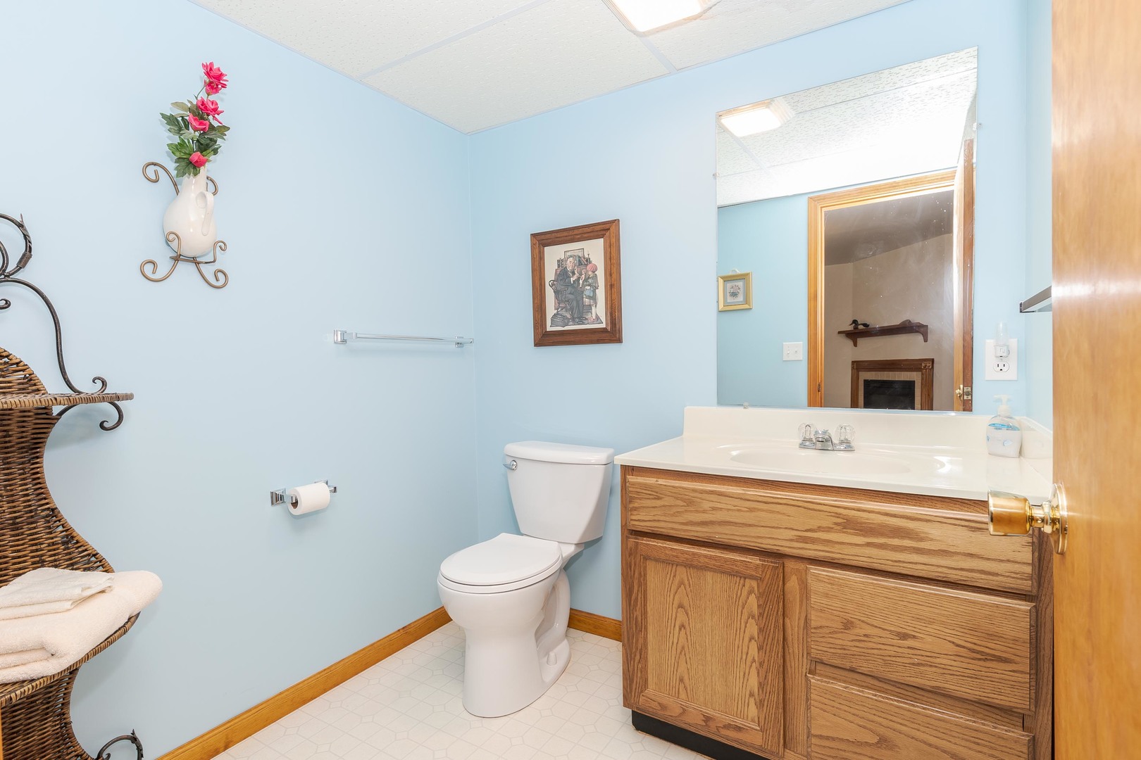 103 East 9th Street Gridley, IL 61744 - Photo 36 of 45 a bathroom with a sink mirror vanity and toilet