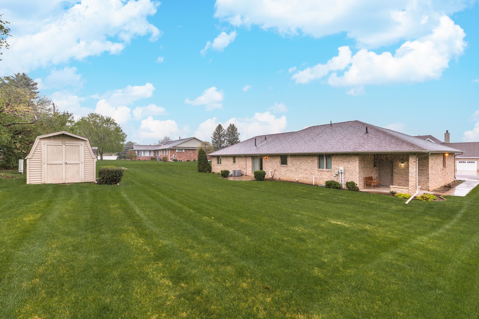 103 East 9th Street Gridley, IL 61744 - Photo 42 of 45 a view of a big house with a big yard and large trees