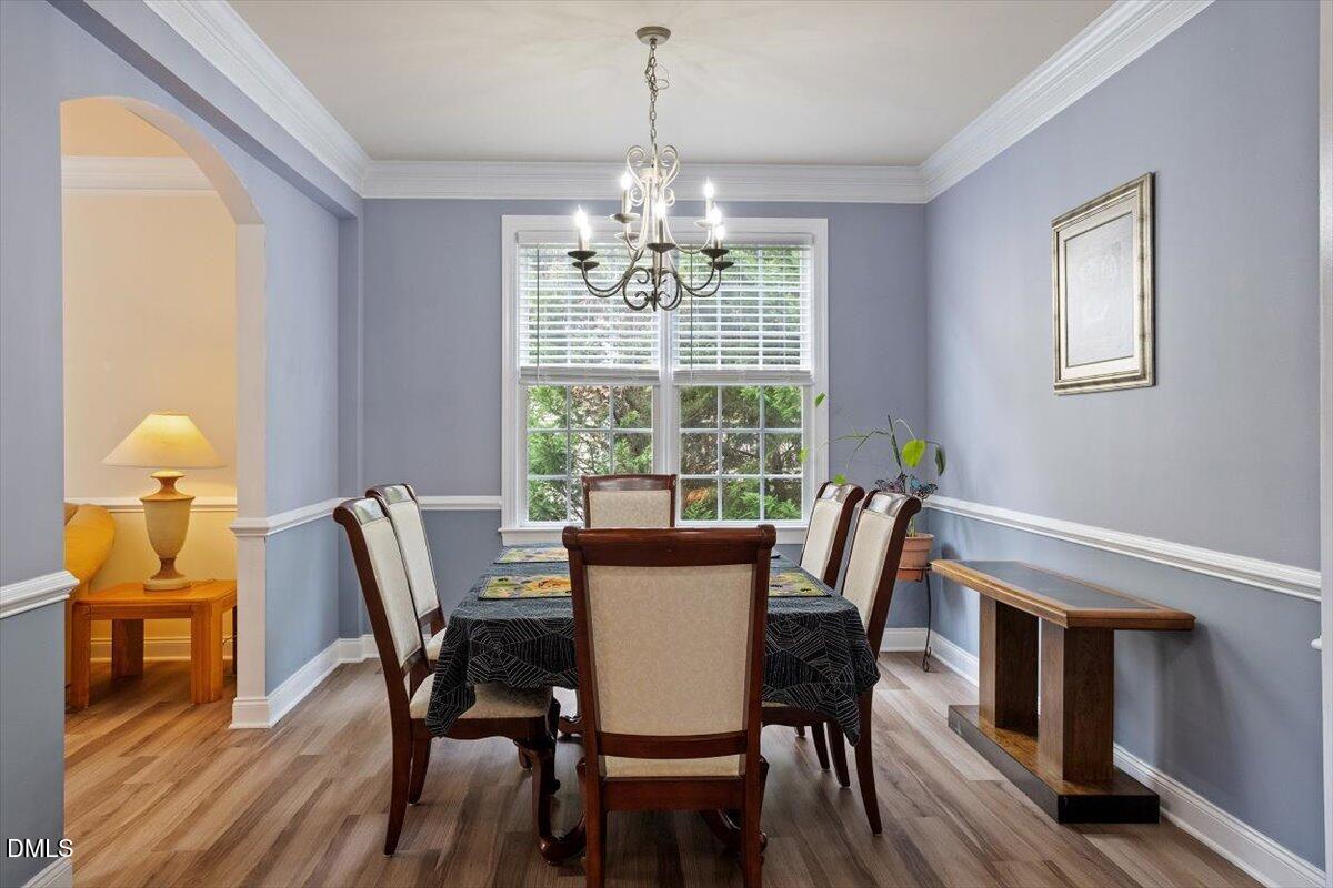9208 Palm Bay Circle Raleigh, NC 27617 - Photo 12 of 54 a view of a dining room with furniture window and wooden floor