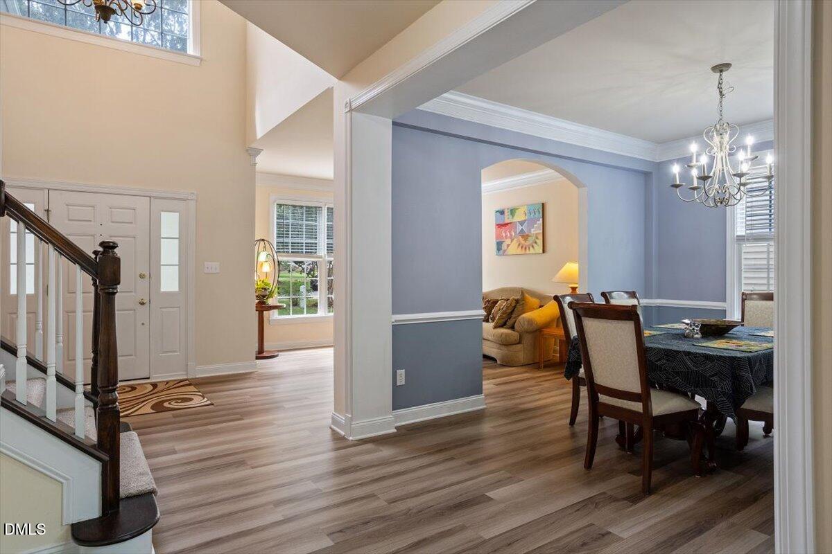 9208 Palm Bay Circle Raleigh, NC 27617 - Photo 14 of 54 a view of a dining room with furniture and wooden floor