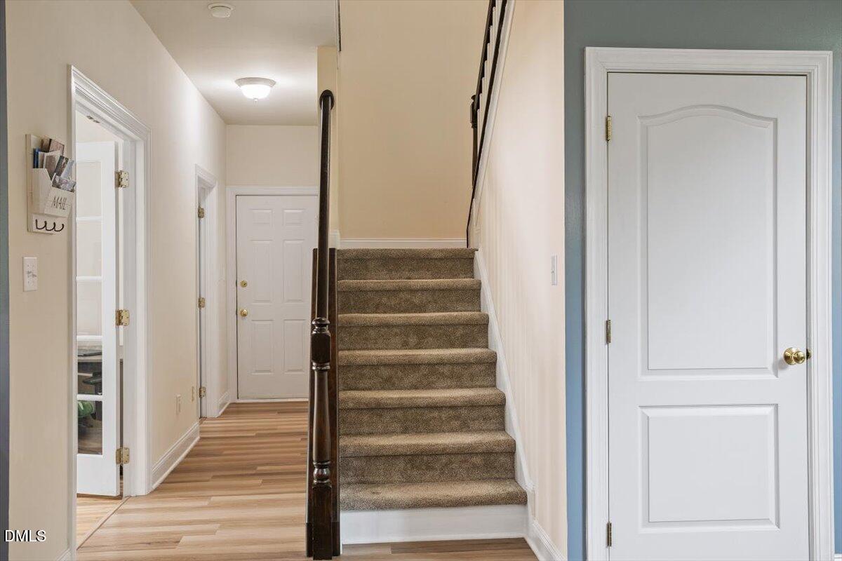 9208 Palm Bay Circle Raleigh, NC 27617 - Photo 26 of 54 a view of an entryway with wooden floor