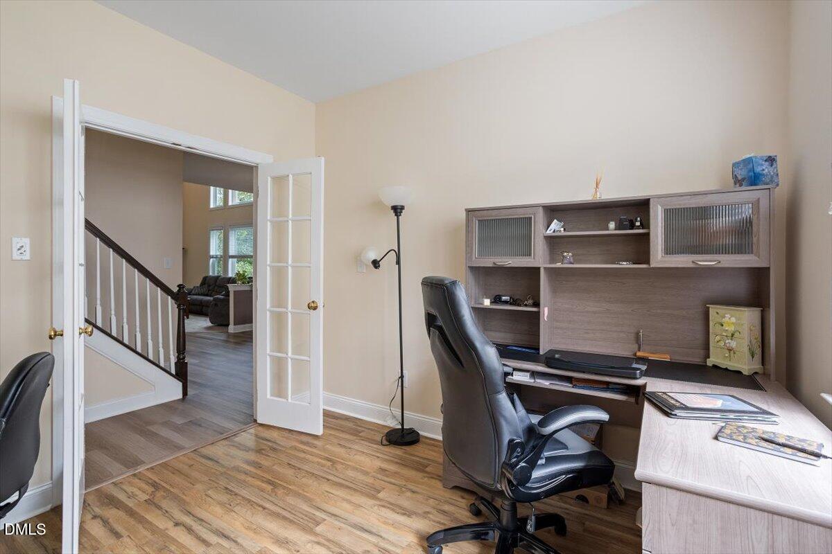 9208 Palm Bay Circle Raleigh, NC 27617 - Photo 27 of 54 a workspace with furniture and wooden floor