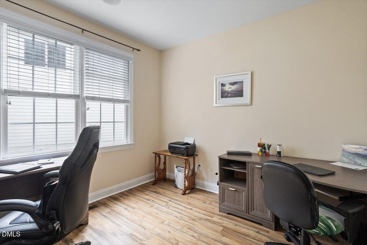 9208 Palm Bay Circle Raleigh, NC 27617 - Photo 28 of 54 a view of a workspace with furniture and a window