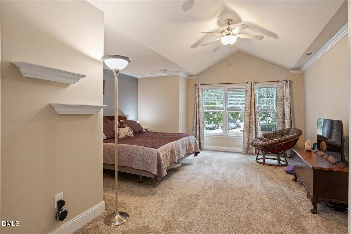 9208 Palm Bay Circle Raleigh, NC 27617 - Photo 33 of 54 a bedroom with furniture and a window