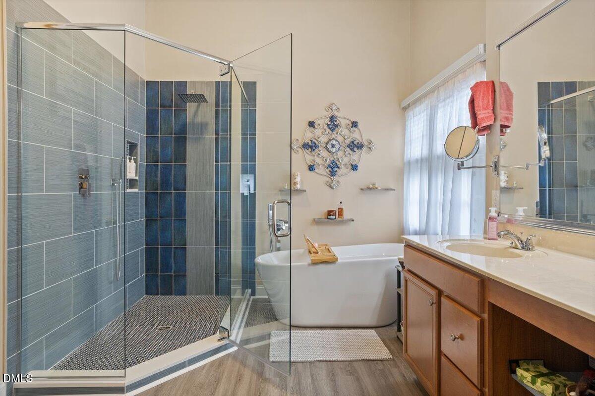 9208 Palm Bay Circle Raleigh, NC 27617 - Photo 36 of 54 a bathroom with a sink a toilet and shower