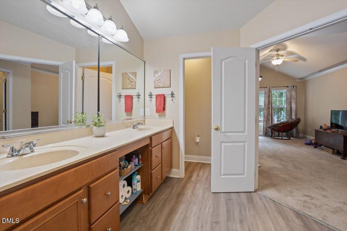 9208 Palm Bay Circle Raleigh, NC 27617 - Photo 37 of 54 a spacious bathroom with a double vanity sink and a mirror