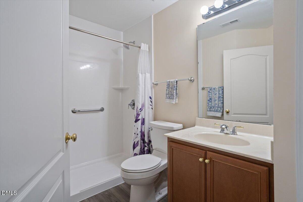 9208 Palm Bay Circle Raleigh, NC 27617 - Photo 49 of 54 a bathroom with a sink toilet and shower