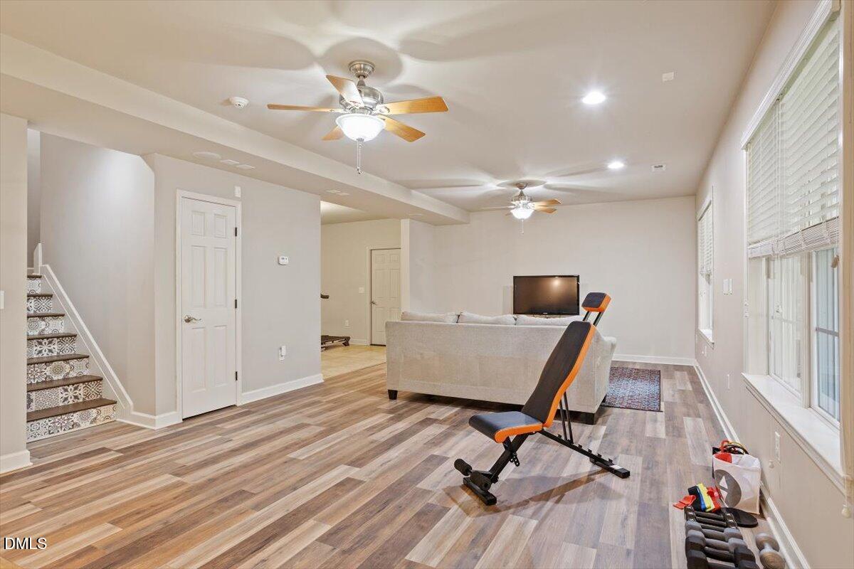 9208 Palm Bay Circle Raleigh, NC 27617 - Photo 50 of 54 a view of a workspace with furniture and wooden floor