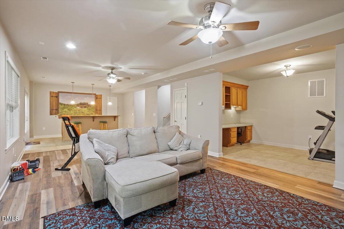 9208 Palm Bay Circle Raleigh, NC 27617 - Photo 51 of 54 a living room with furniture and a rug