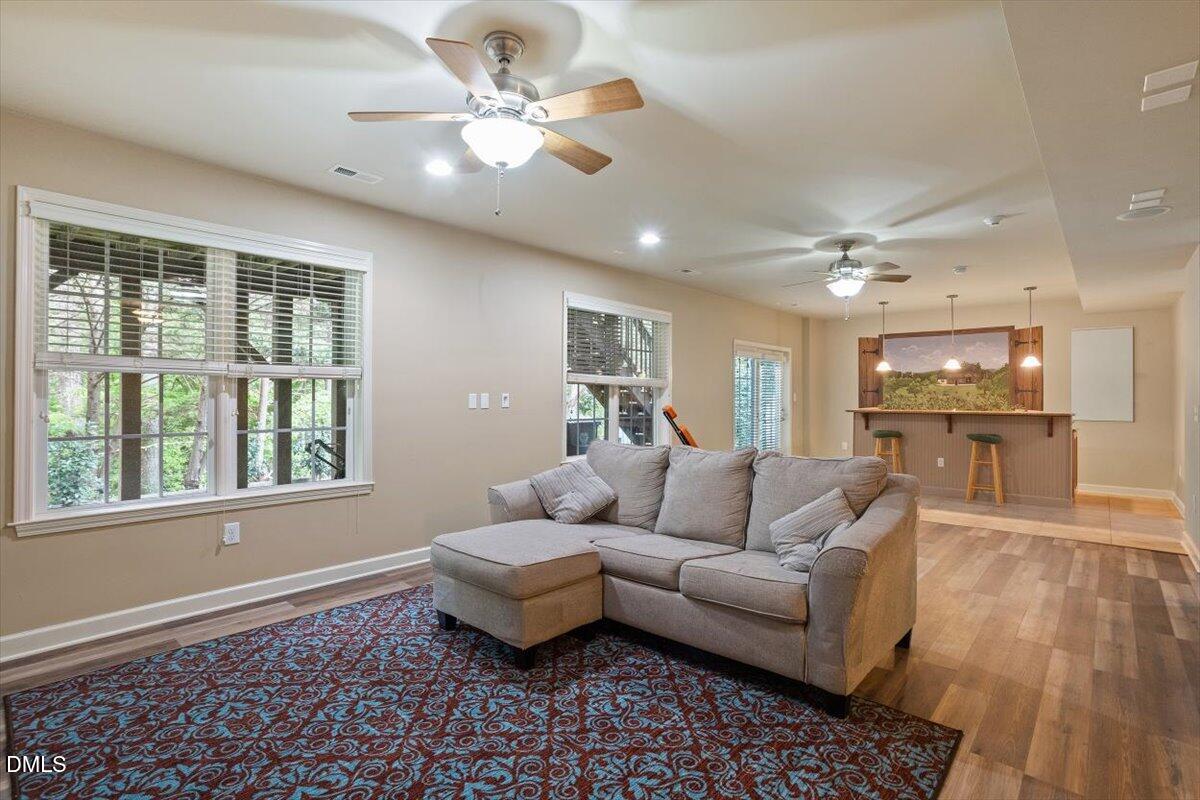 9208 Palm Bay Circle Raleigh, NC 27617 - Photo 52 of 54 a living room with furniture and a large window