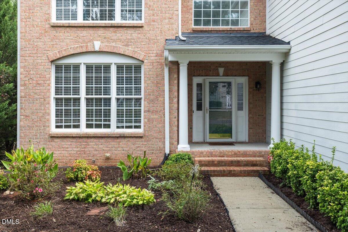 9208 Palm Bay Circle Raleigh, NC 27617 - Photo 5 of 54 a front view of a house with a yard