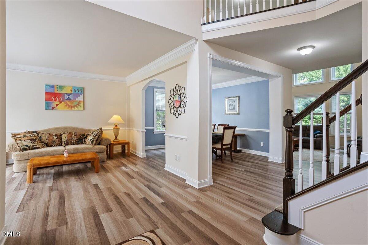 9208 Palm Bay Circle Raleigh, NC 27617 - Photo 7 of 54 a living room with furniture and wooden floor